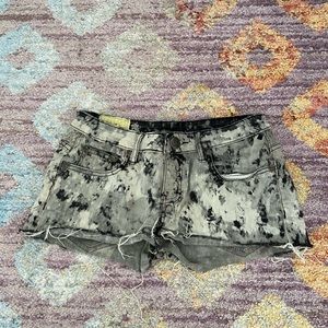 Black splatter painted jean shorts